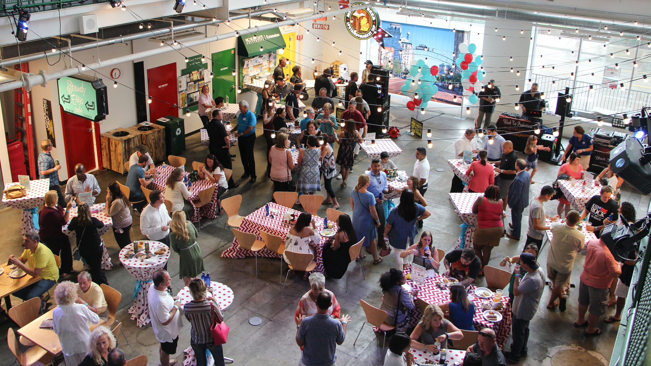 Chamber members enjoying the 9th annual Hot Dogs & Hot Rods Member Appreciation Cookout, Flint, MI