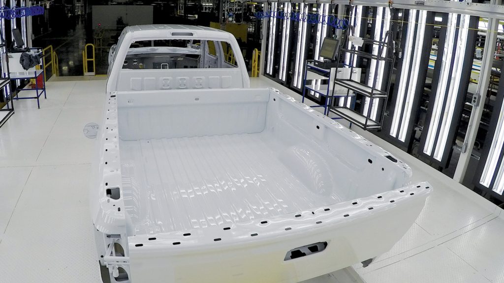 Truck progressing through the GM paint shop, Flint, MI