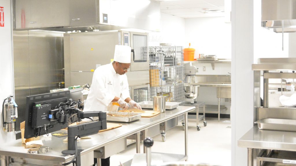 Students learn culinary techniques at Mott Community College Culinary Institute
