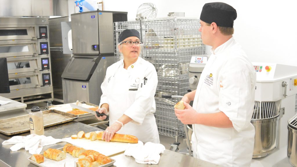 Students learn culinary techniques at Mott Community College Culinary Institute