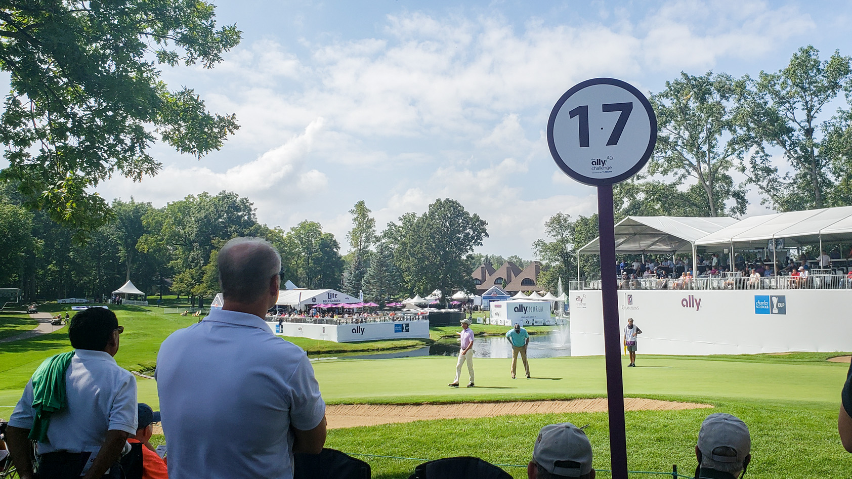 Fans watch golfers from 17th hole at Ally Challenge in Grand Blanc, MI