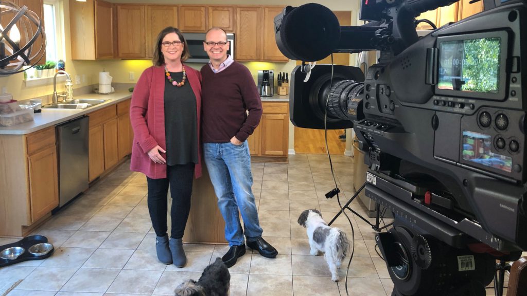 Matt Bach and wife appear in their kitchen in front of HGTV House Hunter camera