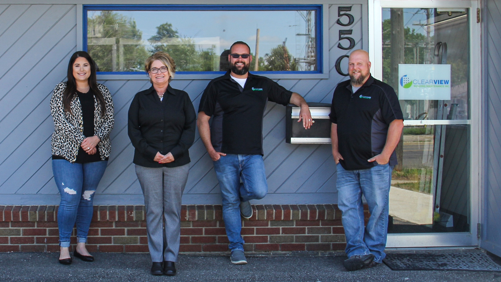 Owner and President Dena Craine and staff outside Clearview office