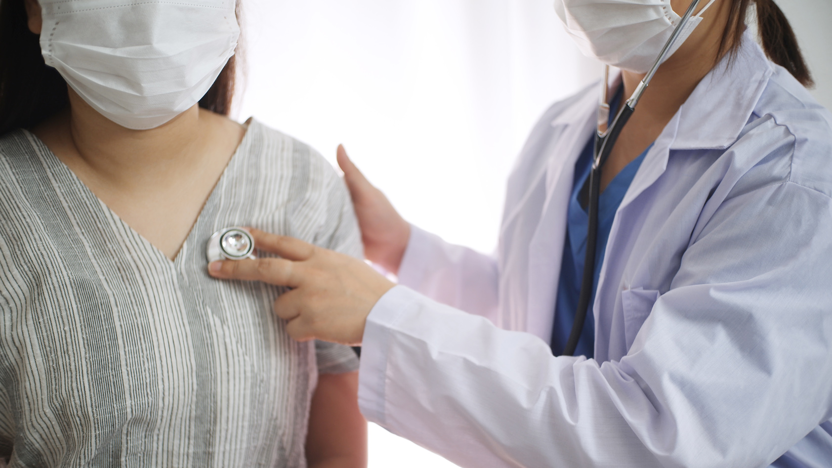 Doctor listens to a patient's heart