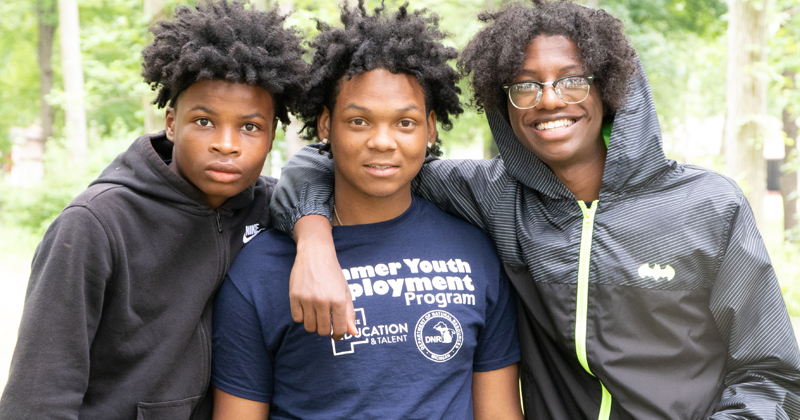 students participate in a park clean-up