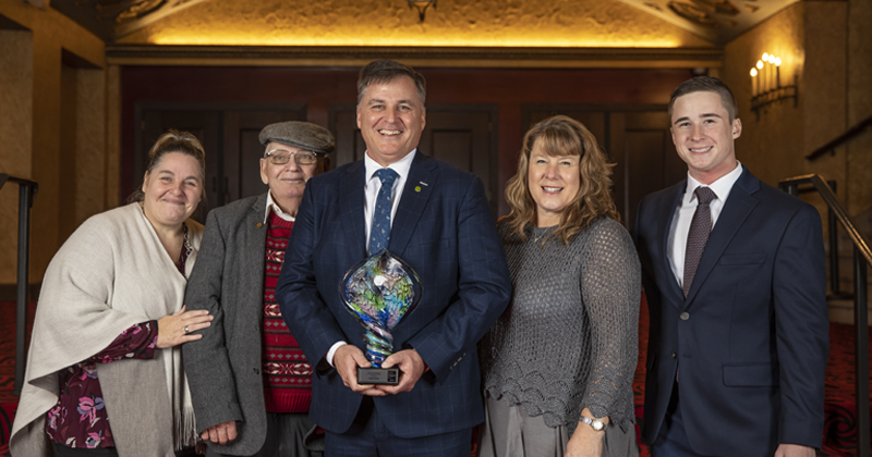 Greg Viener accepts award