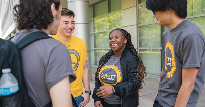 A group of Mott Community College students laughing