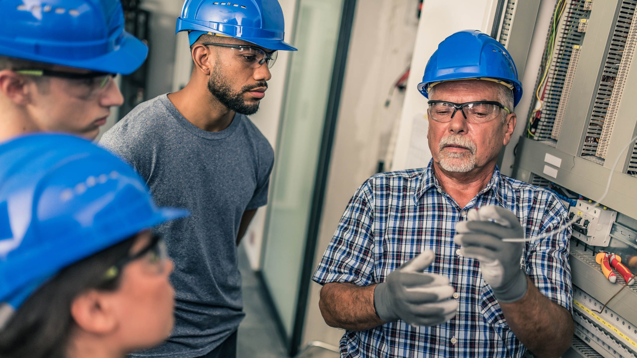 Employee training a group of apprentices