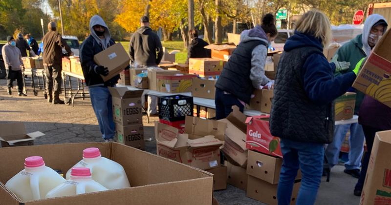 Volunteers sort food at the Martus Luna Food Pantry