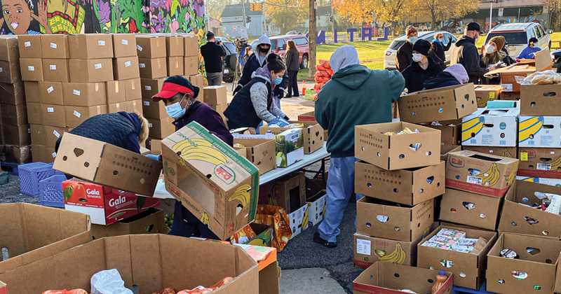 Volunteers sort food at the Martus Luna Food Pantry