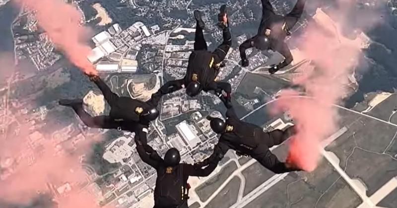 Parachute jumpers appear at an air show