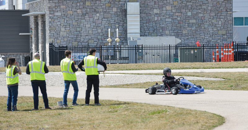 Kettering students test a kart on the mobility track
