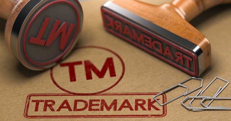 A document marked "TM Trademark" with a rubberstamp