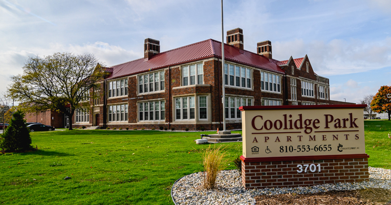 The former Coolidge Elementary School, a two-story brick building, was converted into 54 units of mixed-income housing.