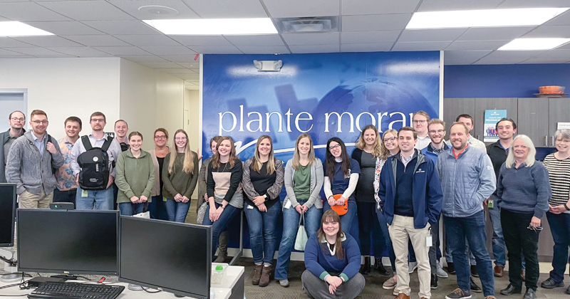 A group staff photo of 24 Plante Moran employees.