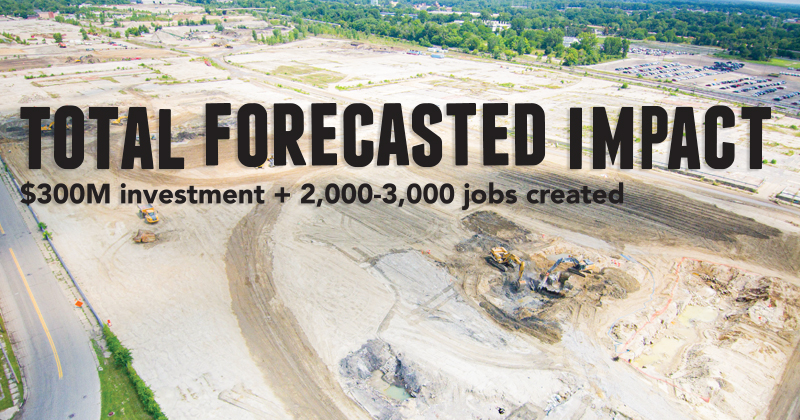 Aerial view of excavation equipment clear a brownfield for development
